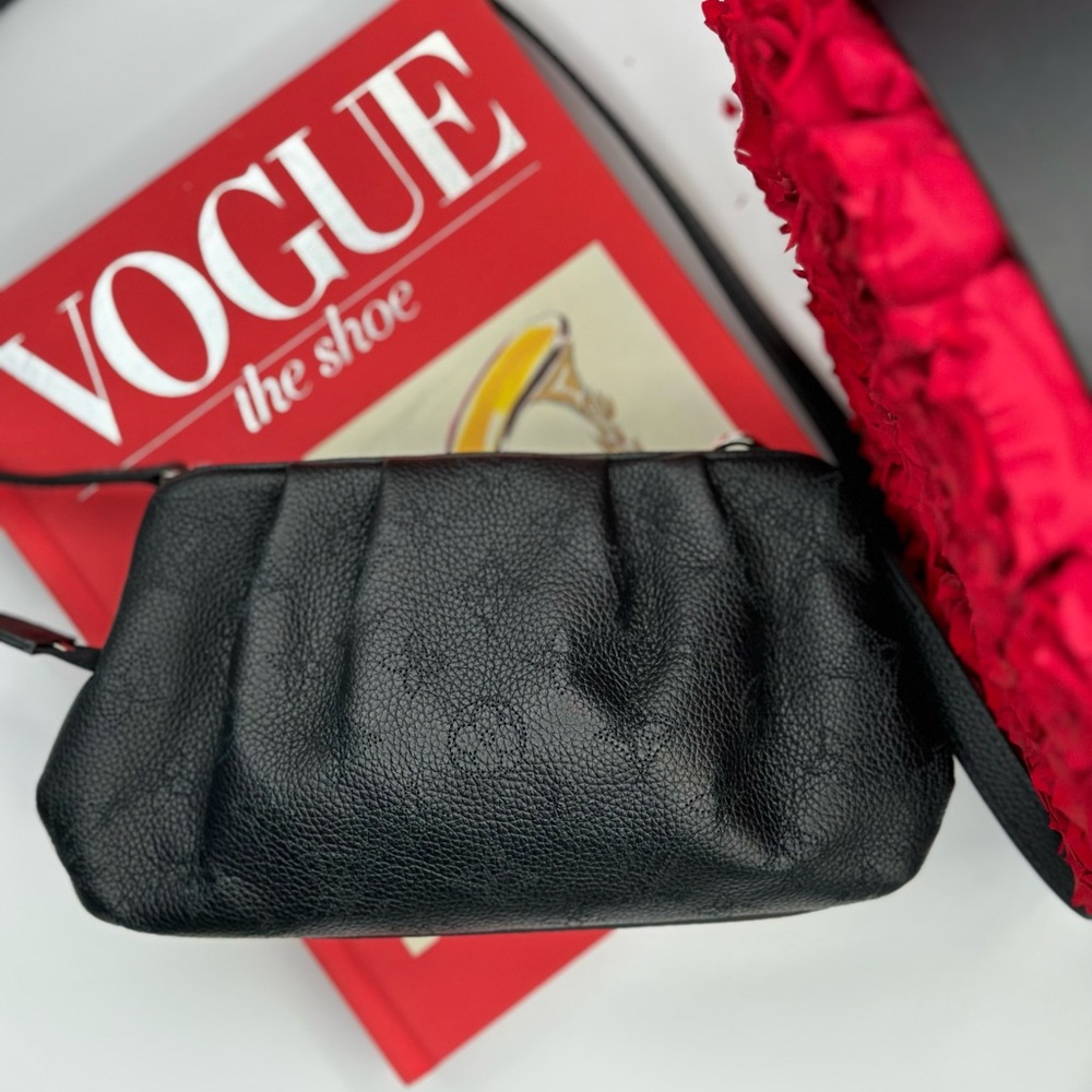 Louis Vuitton  mahina scala mini pouch in black color. In a perfect condition.